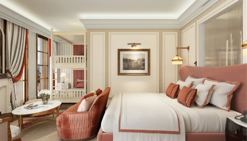 Phòng Family tại Hôtel de l'Amour Tam Đảo với giường King đầu giường bọc hồng, giường tầng trắng cạnh cửa sổ và ghế bành